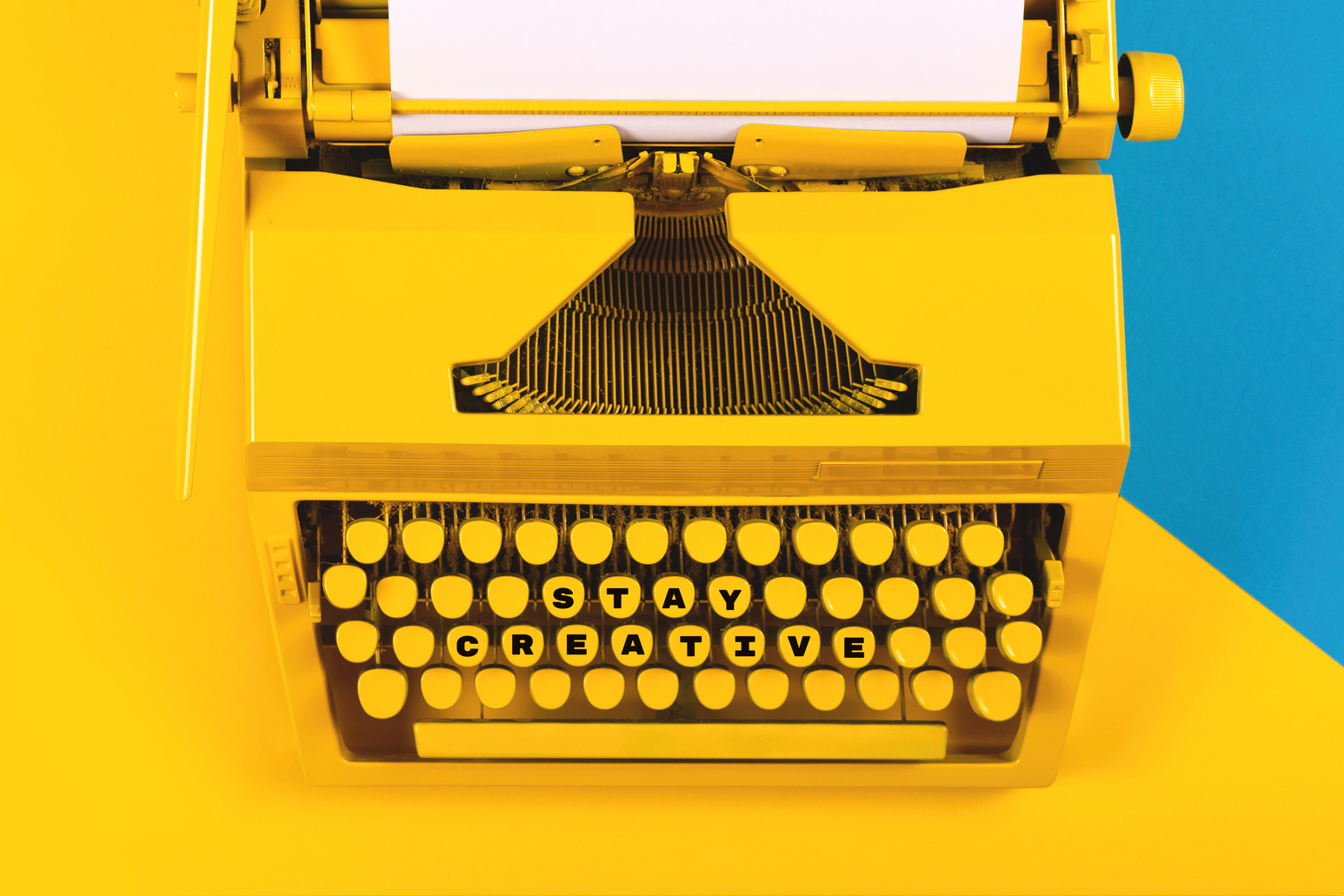 Stay Creative Written on a Typewriter